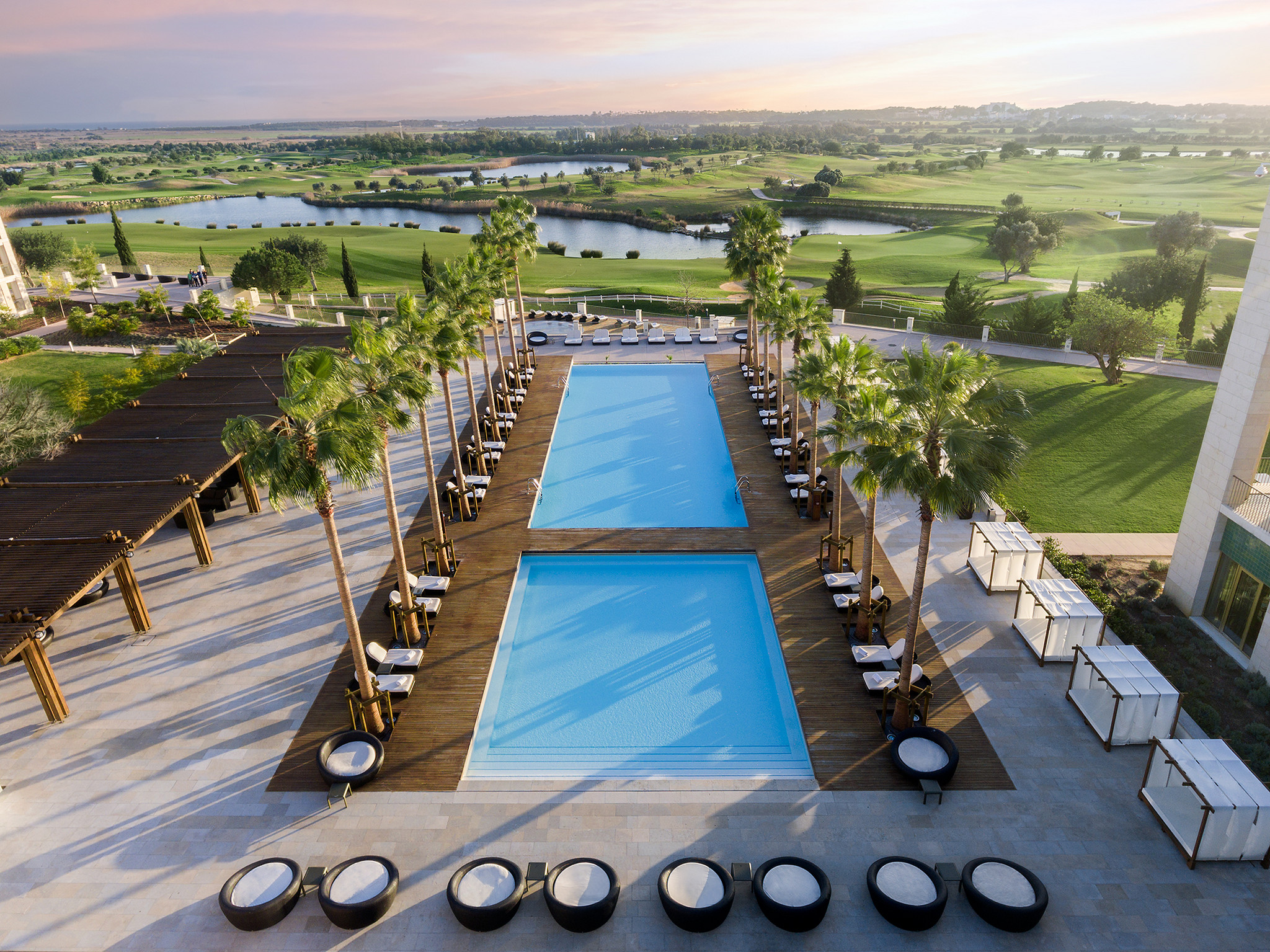 Anantara Vilamoura - main pool with golf course backdrop.jpg