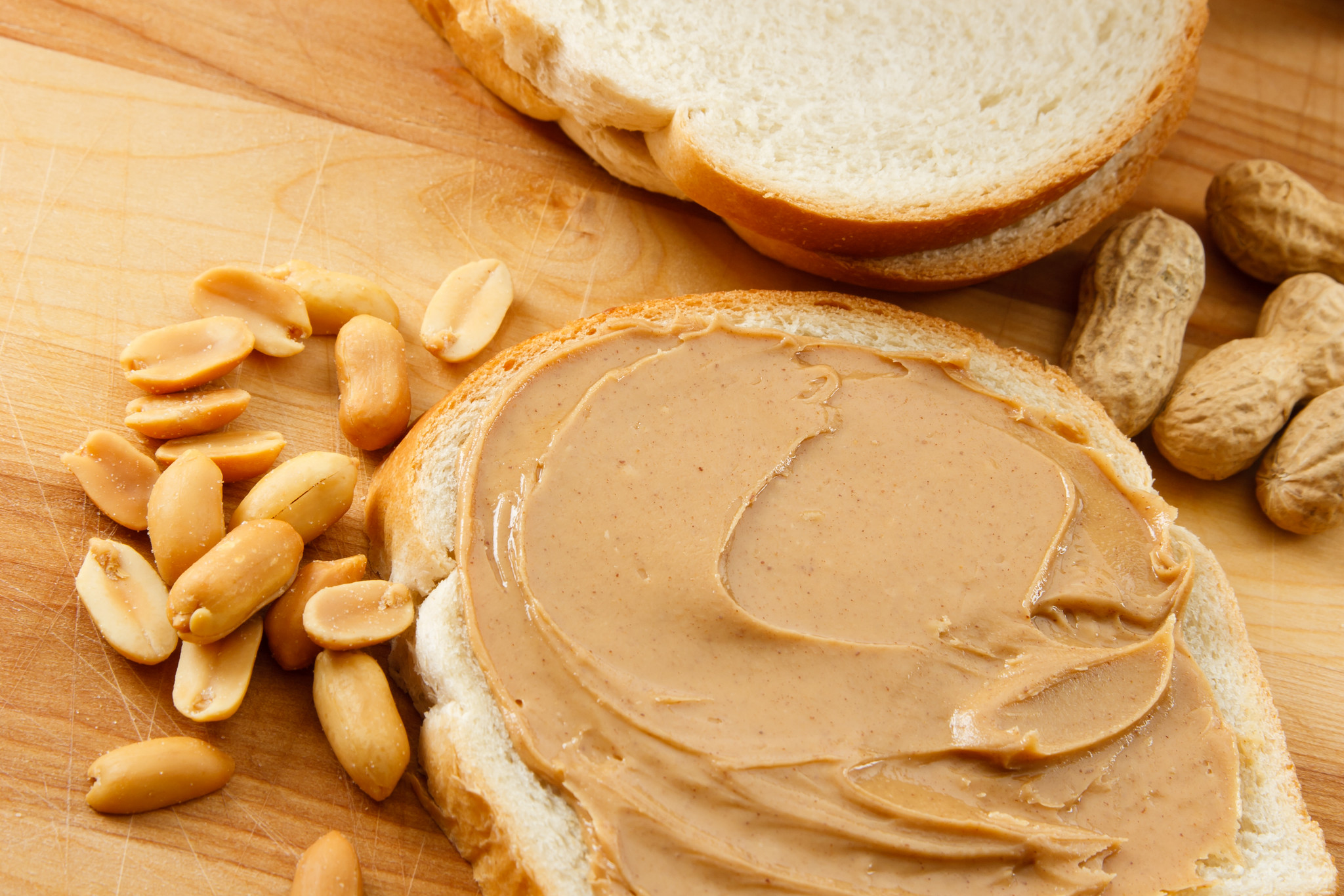 peanut-butter-on-bread-with-pe-13614866.jpg